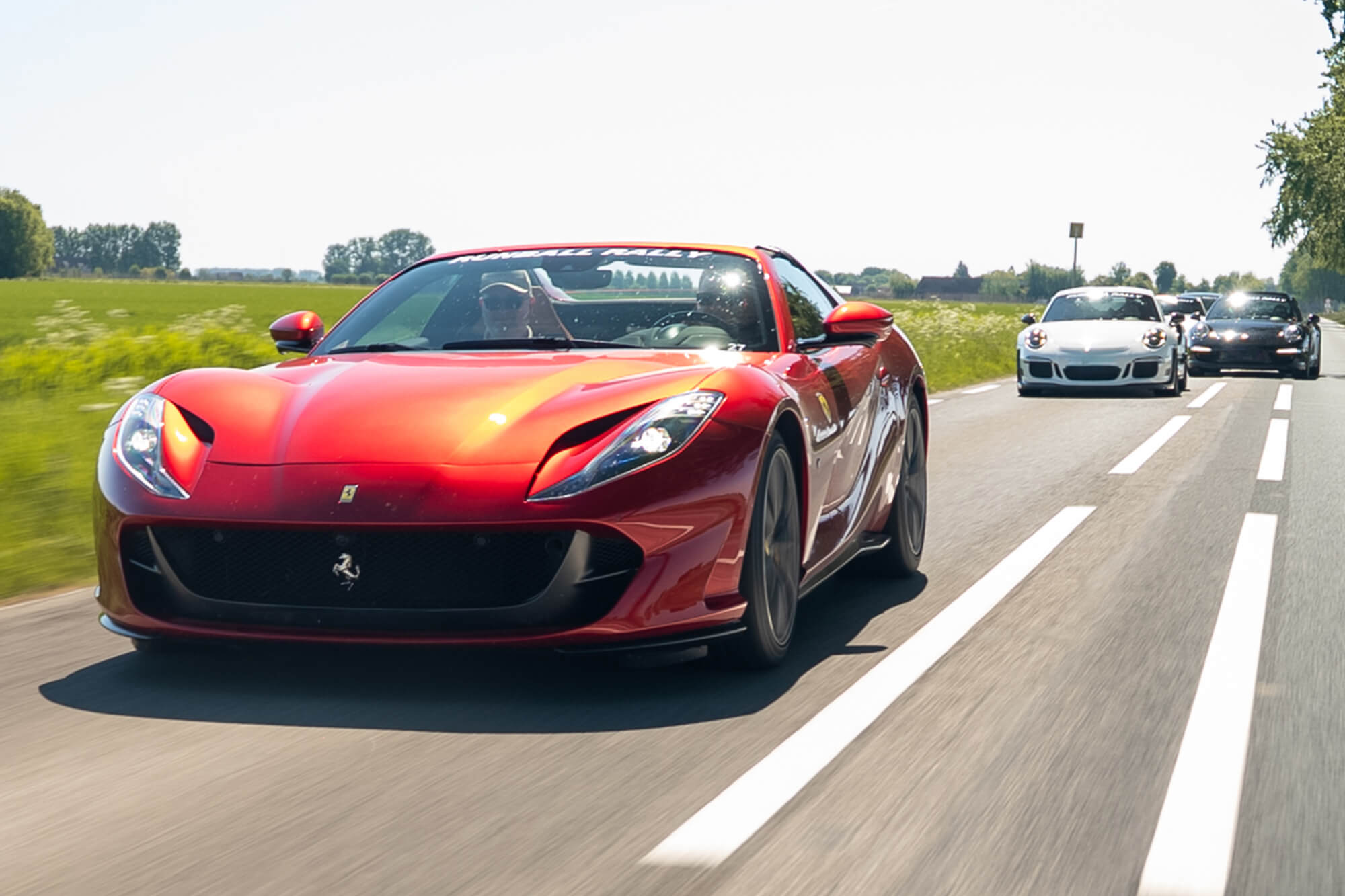 Ferrari and Porsches during the Runball Rally One Day Tour in Zeeland