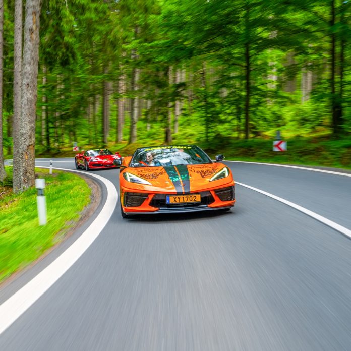 Runball Corvette Orange with a Red Ferrari behind