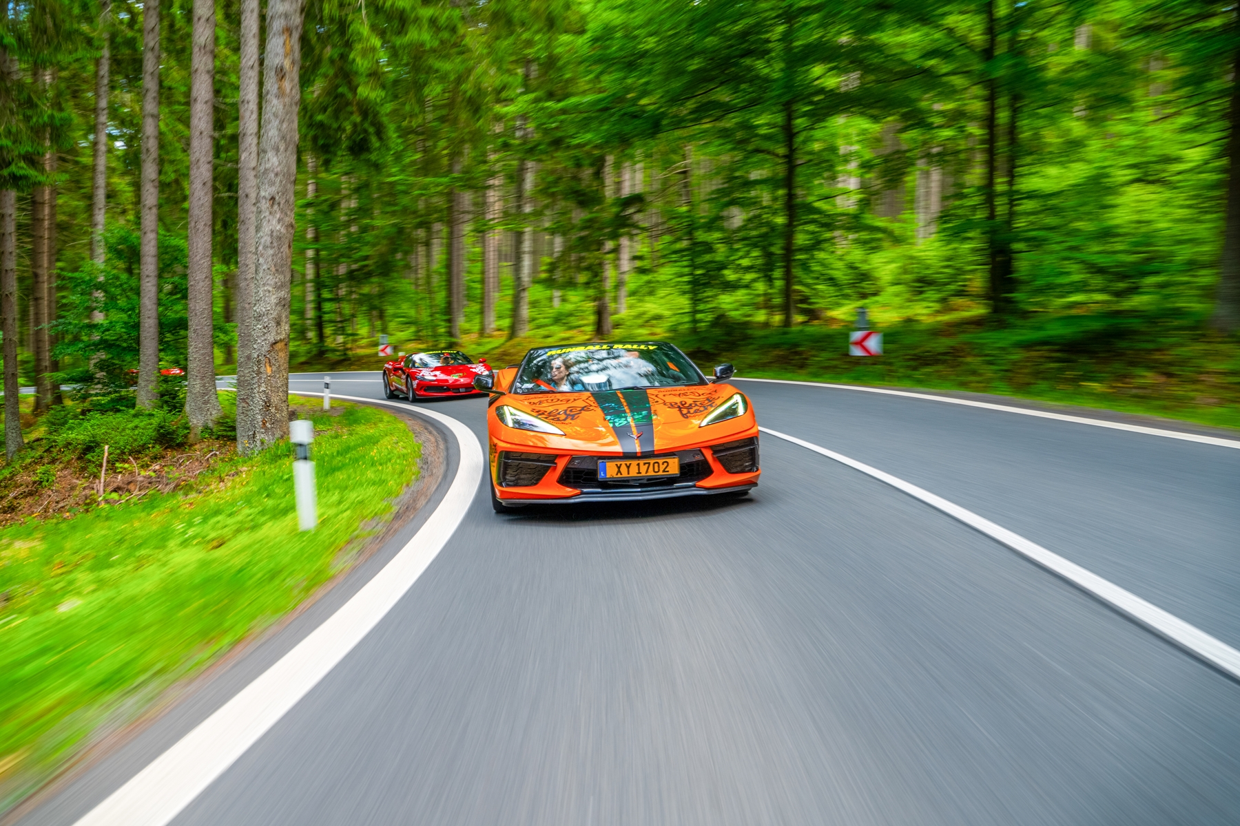 Runball Corvette Orange with a Red Ferrari behind